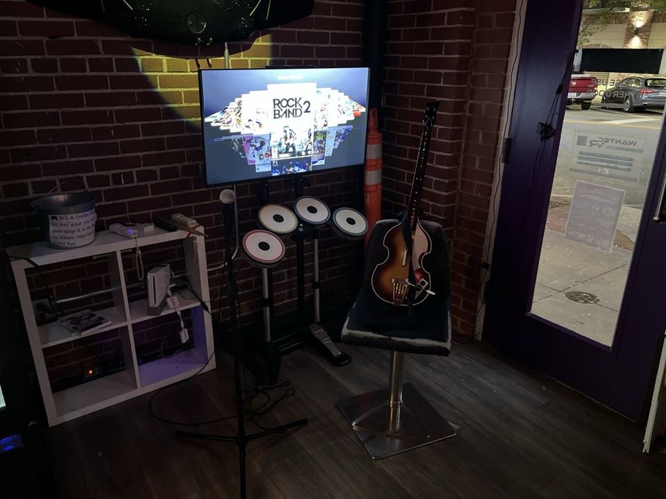 Rock Band corner with drums, guitar and microphone